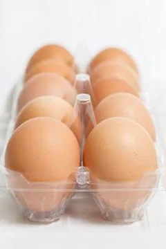 Fresh eggs in pack isolated on white background Stock Photos
