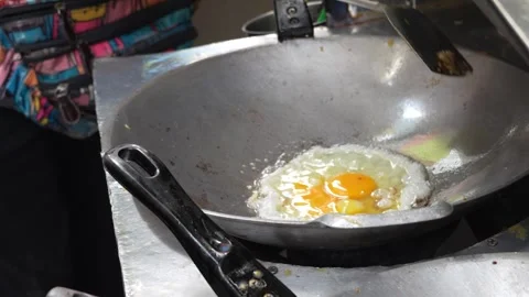 Fresh eggs in the pan, prepares an omelet from fresh farm eggs Stock Footage 301491702