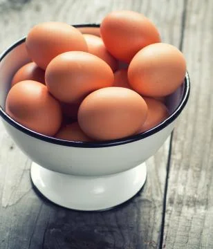 Fresh eggs on table Stock Photos