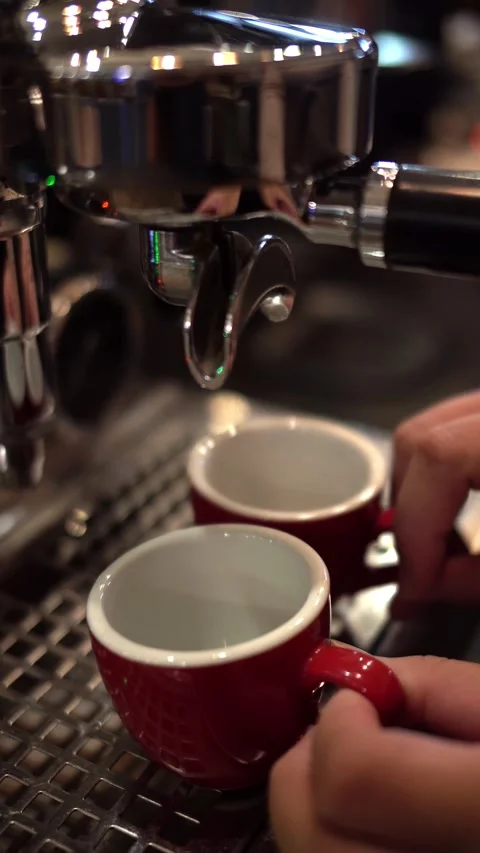 Fresh espresso flows from coffee machine Stock Footage 310747209