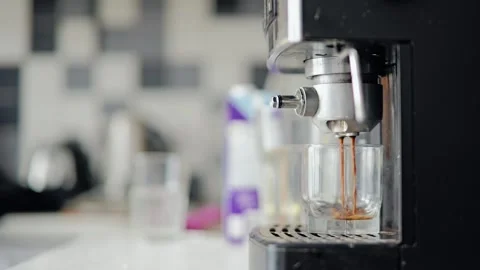 Fresh Espresso Streams Into Clear Glass From Coffee Machine, Smooth Slow Motion Stock Footage 346060290