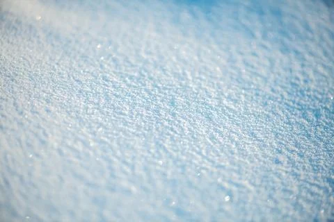 Fresh fallen snow creates a pristine textured blanket, sparkling with tiny ice Stock Photos