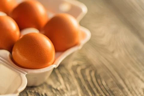 Fresh farm brown eggs on rustic background Foto stock