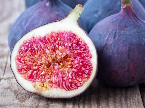 Fresh Fig and cut off half Stock Photos
