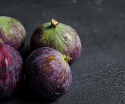 Fresh figs close-up on black background Stock Photos