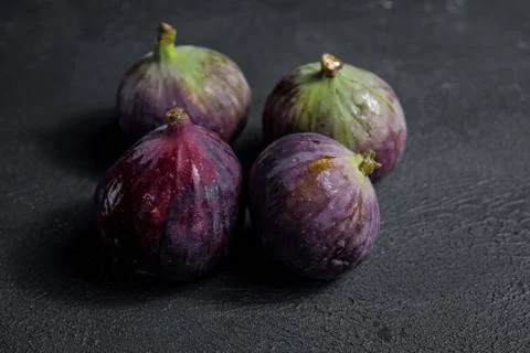 Fresh figs close-up on black background Stock Photos