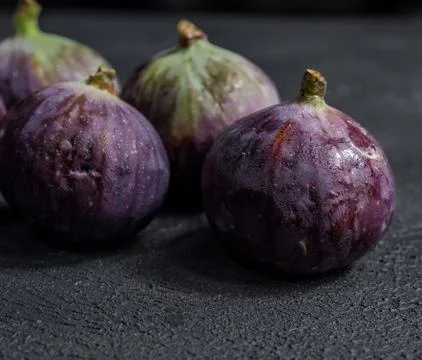 Fresh figs close-up on black background Stock Photos