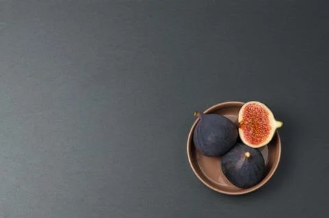 Fresh figs on dark slate background, top view Stock Photos