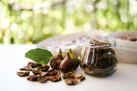 Fresh figs lie on the table next to dried figs Stock Photos