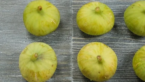 Fresh figs on a table. Overhead slider shot. Video stock 113772924