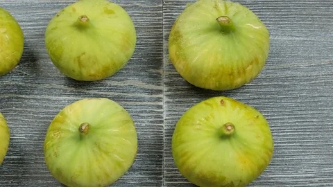 Fresh figs on a table. Overhead slider shot. Stock Footage 113773466