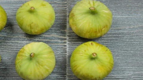 Fresh figs on a table. Overhead slider shot. Stock Footage 113773979