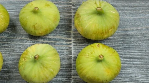 Fresh figs on a table. Overhead slider shot. Stock Footage 113774063