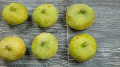 Fresh figs on a table. Overhead slider shot. Stock Footage 113774240