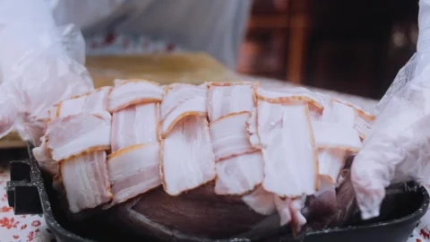 Fresh finished dish: securing a bacon wrapped tenderloin Stock Footage 342184824