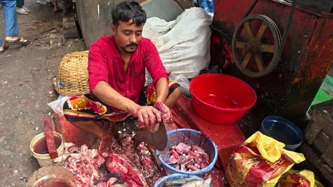 Fresh Fish Being Cut and Prepared by Vendor in Dhaka Stock-Footage 343154872