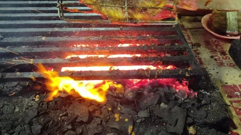 Fresh fish being grilled to eat Stock Footage 277265205
