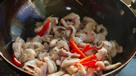 Fresh fish fillets stir-fried with red pepper in a wok Видео 341342559