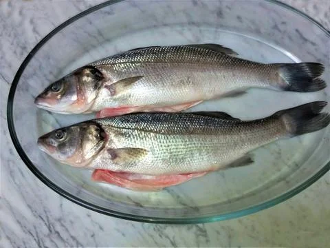 Fresh fish on a marble Foto stock