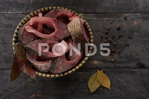 Fresh fish pieces in a bowl on a table top Stock Photos