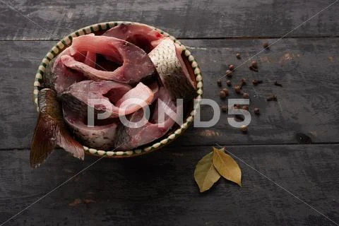 Fresh fish pieces in a bowl on the table Stock Photos