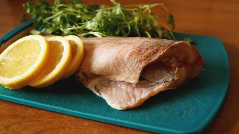 Fresh fish, raw cod fillets with addition of herbs and lemon Stock Photos