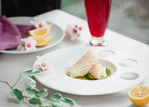 Fresh fish with sauce on the table Stock Photos