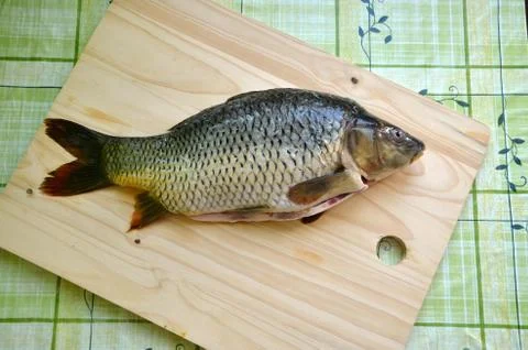 Fresh fish on the table (carp) Stock Photos
