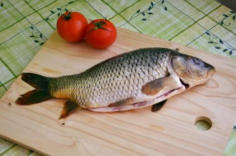 Fresh fish on the table (carp) Stock Photos