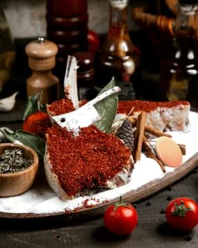 Fresh fish under red pepper on the table Stock Photos