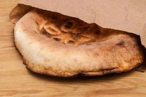 Fresh flatbread in a paper bag on the table Stock Photos