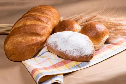 Fresh fragrant bread on rustic Stock Photos