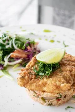 Fresh fried battered cod fish fillet summer light lunch meal Stock Photos