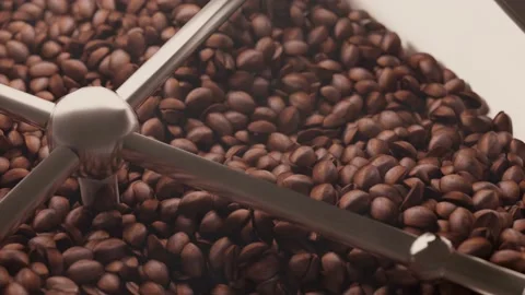 Fresh fried coffee beans roasting with smoke Stock Footage 150339264