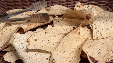 Fresh fried papad kept in bamboo basket in India Stock Footage 317093197