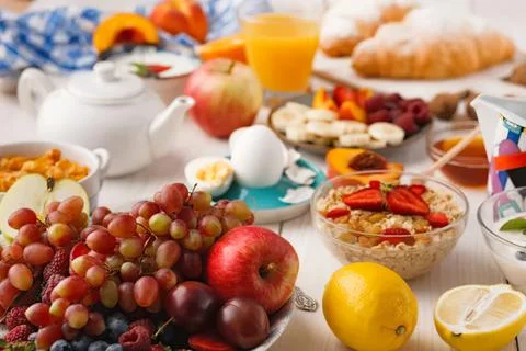 Fresh fruit and breakfast items on table in the morning Stock Photos
