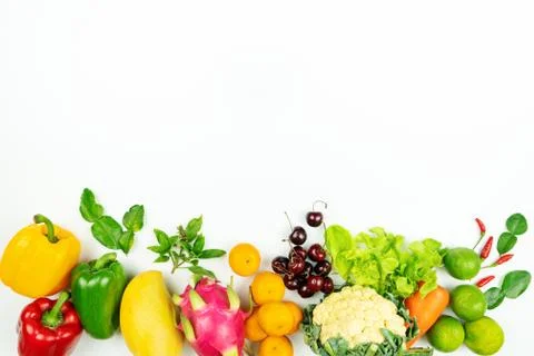 Fresh fruit and vegetable. Flat lay of fresh raw organic vegetables on white  Stock Photos