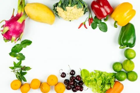 Fresh fruit and vegetable. Frame of fresh raw organic vegetables on white bac Stock Photos
