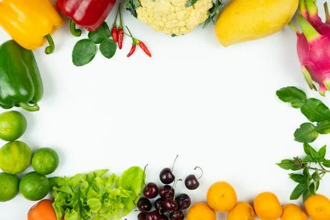 Fresh fruit and vegetable. Frame of fresh raw organic vegetables on white bac Stock Photos