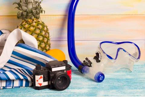 Fresh fruit, camera and a diving mask Stock Photos