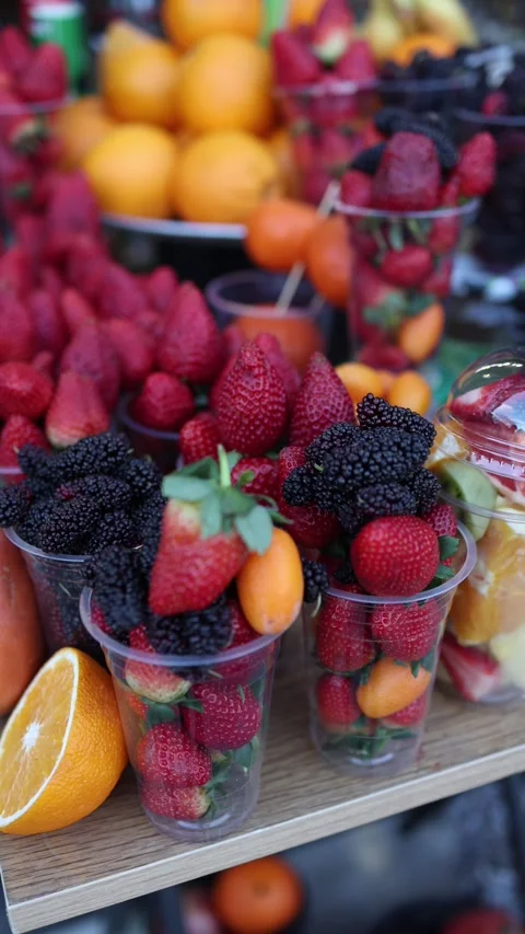 Fresh fruit cups with strawberries blackberries and citrus colorful snack Stock Footage 330904232