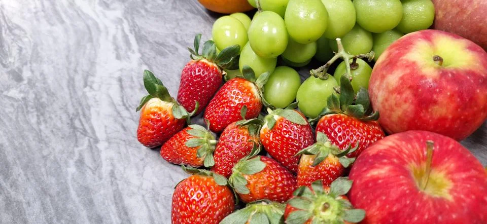 Fresh fruit on a marble table. Stock Photos