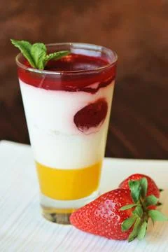 Fresh fruit mousse with cream yogurt.strawberry,b erry,raspberry, mint and ma Stock Photos