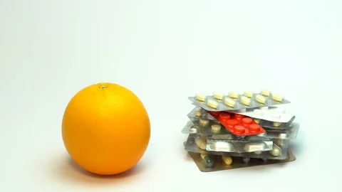 Fresh fruit with multivitamin pills background Stock Footage 88316688