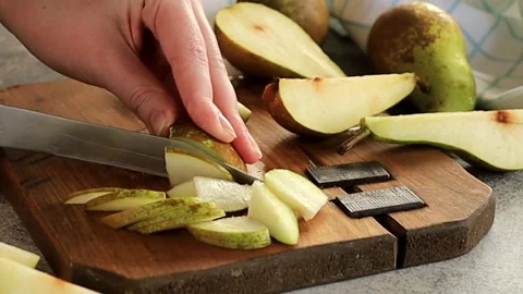 Fresh fruit pears are cut into pieces. Stock Footage 239468246
