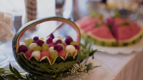Fresh Fruit On A Plate On A Table Watermelon Raspberries Grapes Stock Footage 304798469