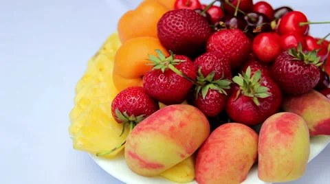 Fresh fruit on a plate.Sliced fresh fruit. Stock Footage 39734292