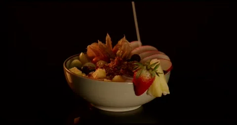 Fresh Fruit Salad With Pineapple and Strawberries in a Bowl Stock Footage 340113754
