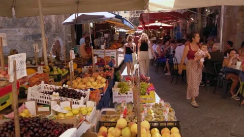 Fresh Fruit Stalls and Walking Pedestrians at Street Market in Palermo Sicily Stock Footage 345148705