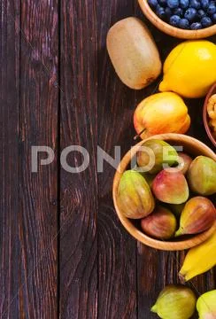 Fresh fruit on the wooden table, autumn fruits Stock Photos